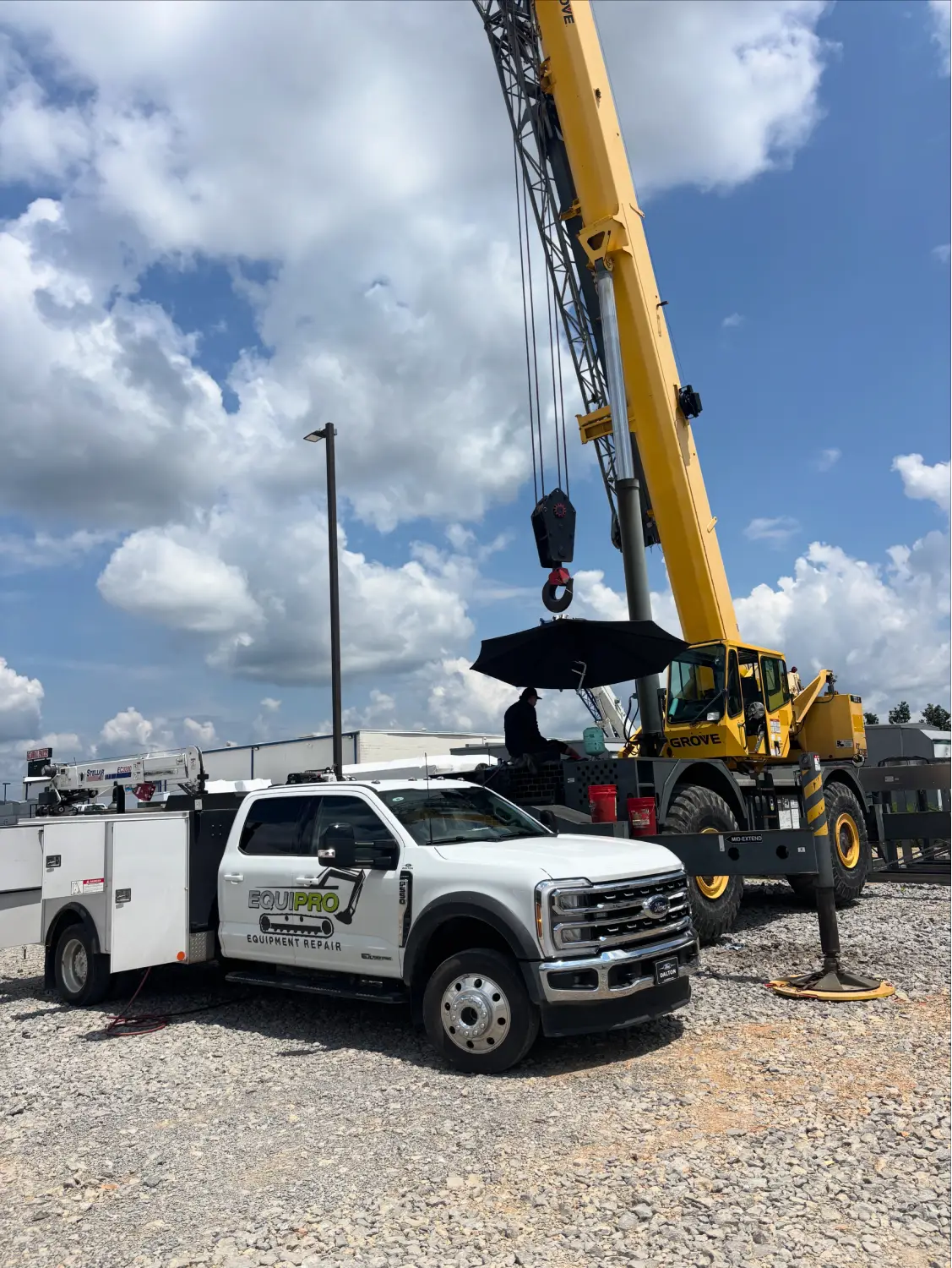 Technician reviewing equipment diagnostics on site